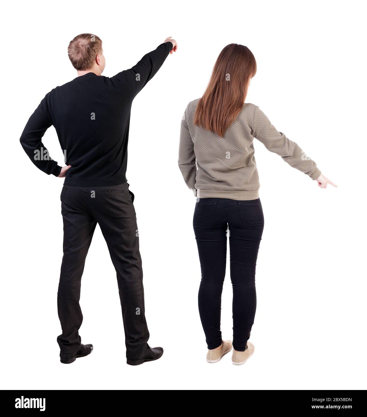 Back view of couple in sweater pointing. Rear view people collection ...