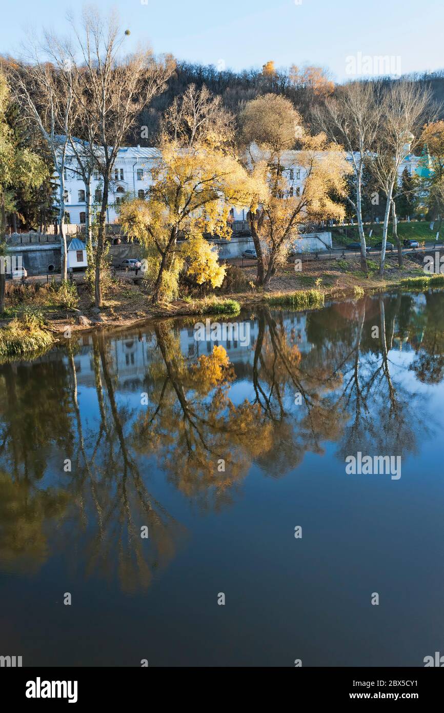 Reflection of autumn trees in the river Siversky Donets. Sviatohirsk, Ukraine Stock Photo