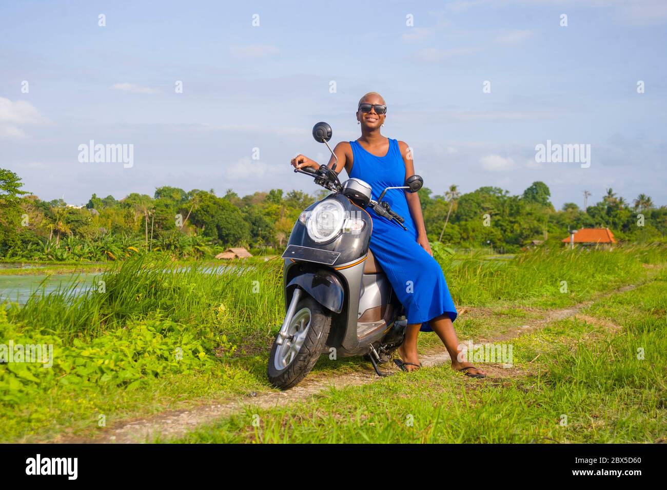 Woman In Helmet Posing On Scooter