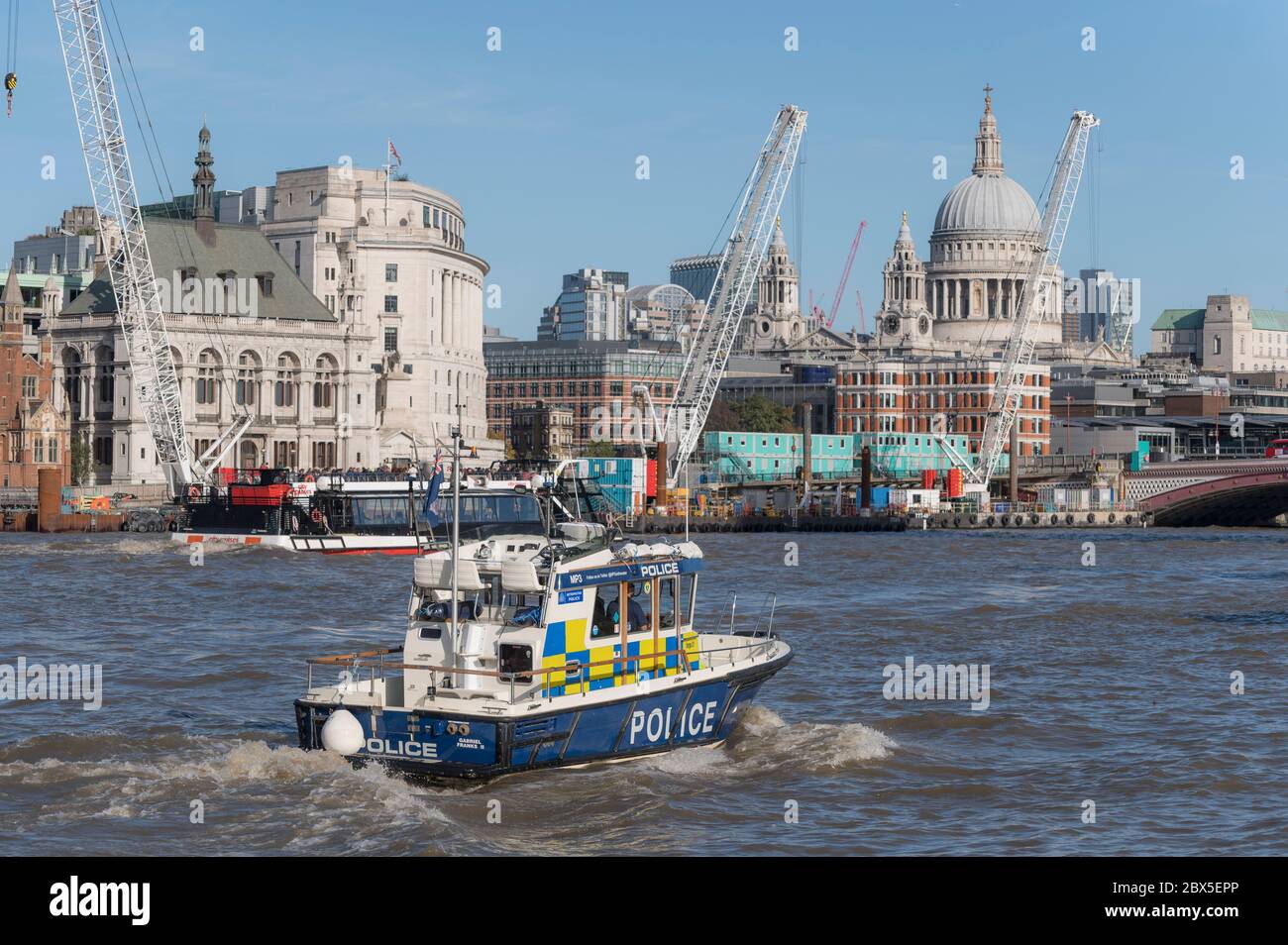 Metropolitan police boat patrolling the River Thames, London, England. Stock Photo