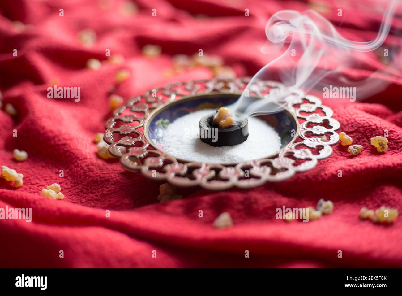 Frankincense burning on a hot coal. aromatic resin, used religious