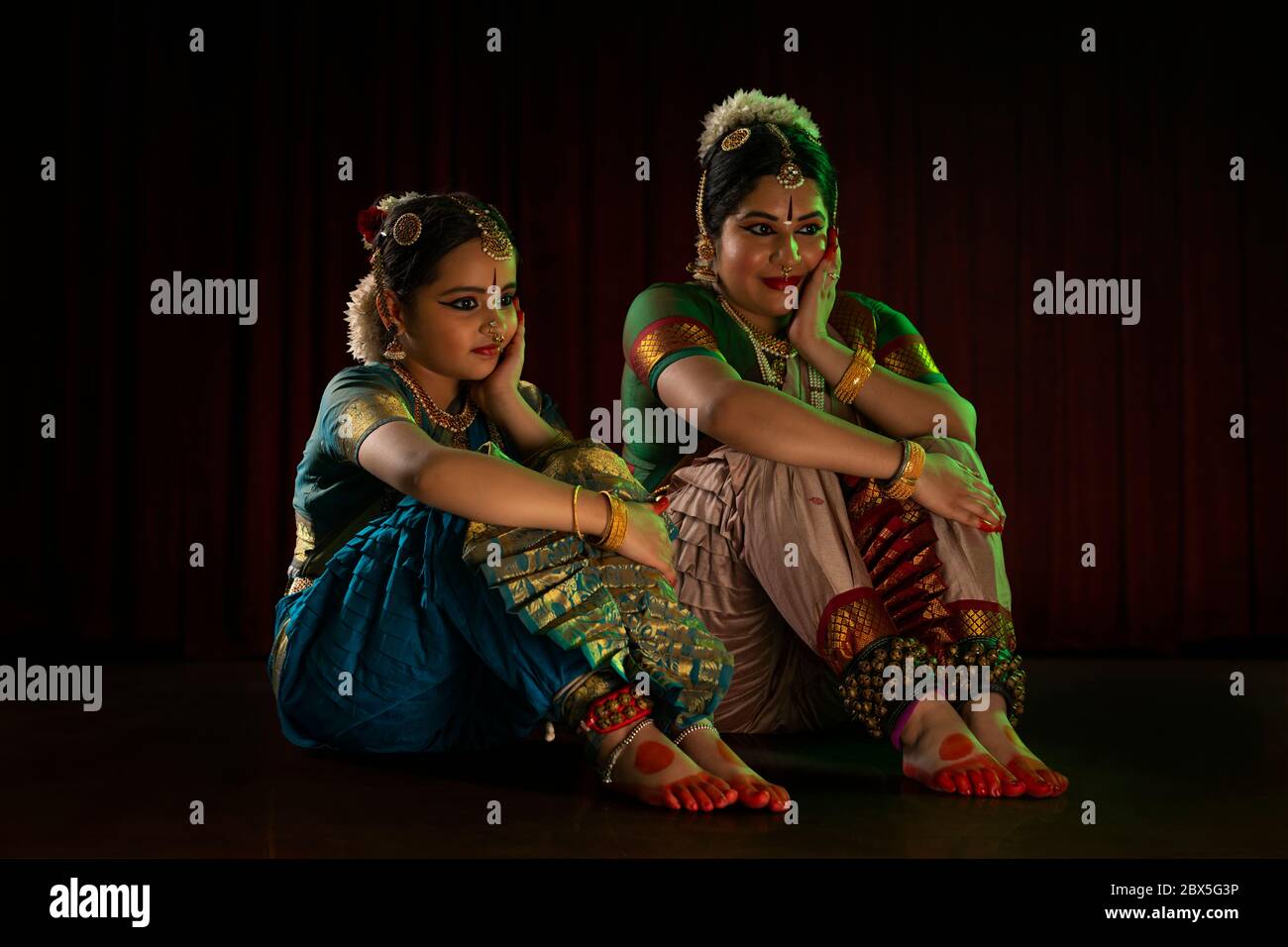 Bharatnatyam dancer performing with her student. Stock Photo