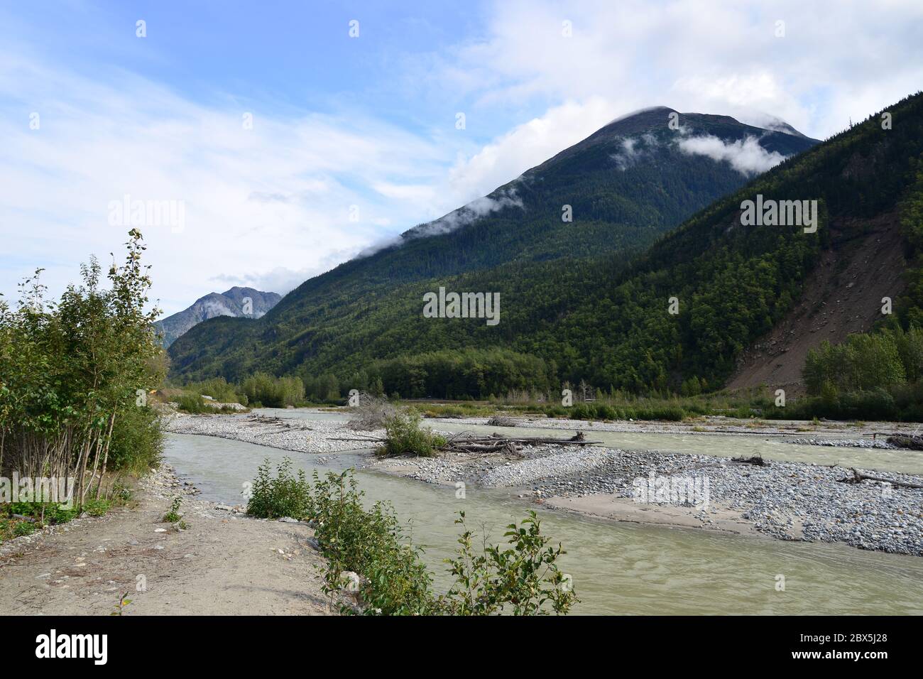 Dyea river, Taiya River, in Skagway, there may have been 'gold in them thar hills' but most of it was found in the river sediments. A tourist attracti Stock Photo