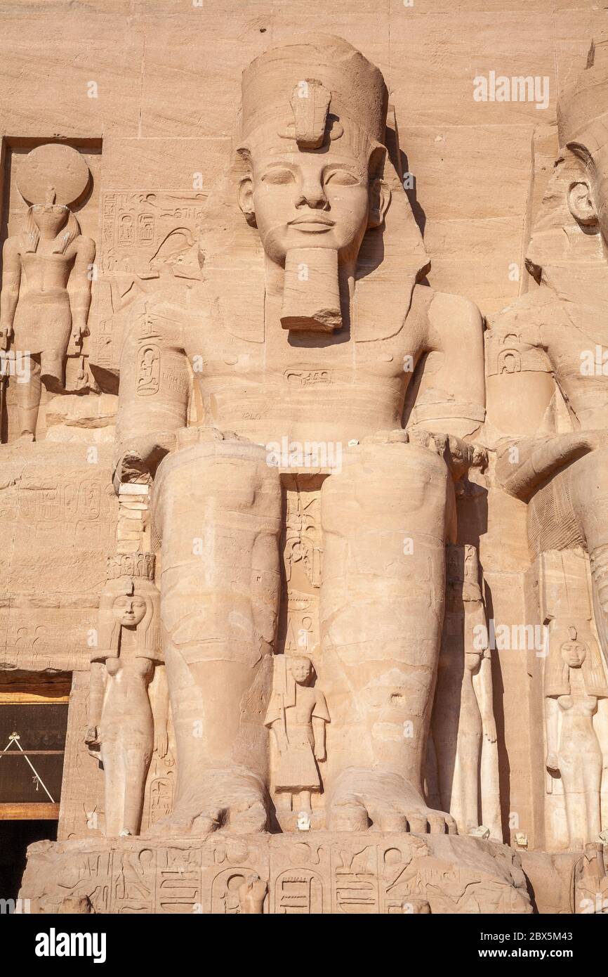 Seating figure, statue. Тhe entrance of Abu Simbel temple of Ramses II at sunrise, Egypt Stock