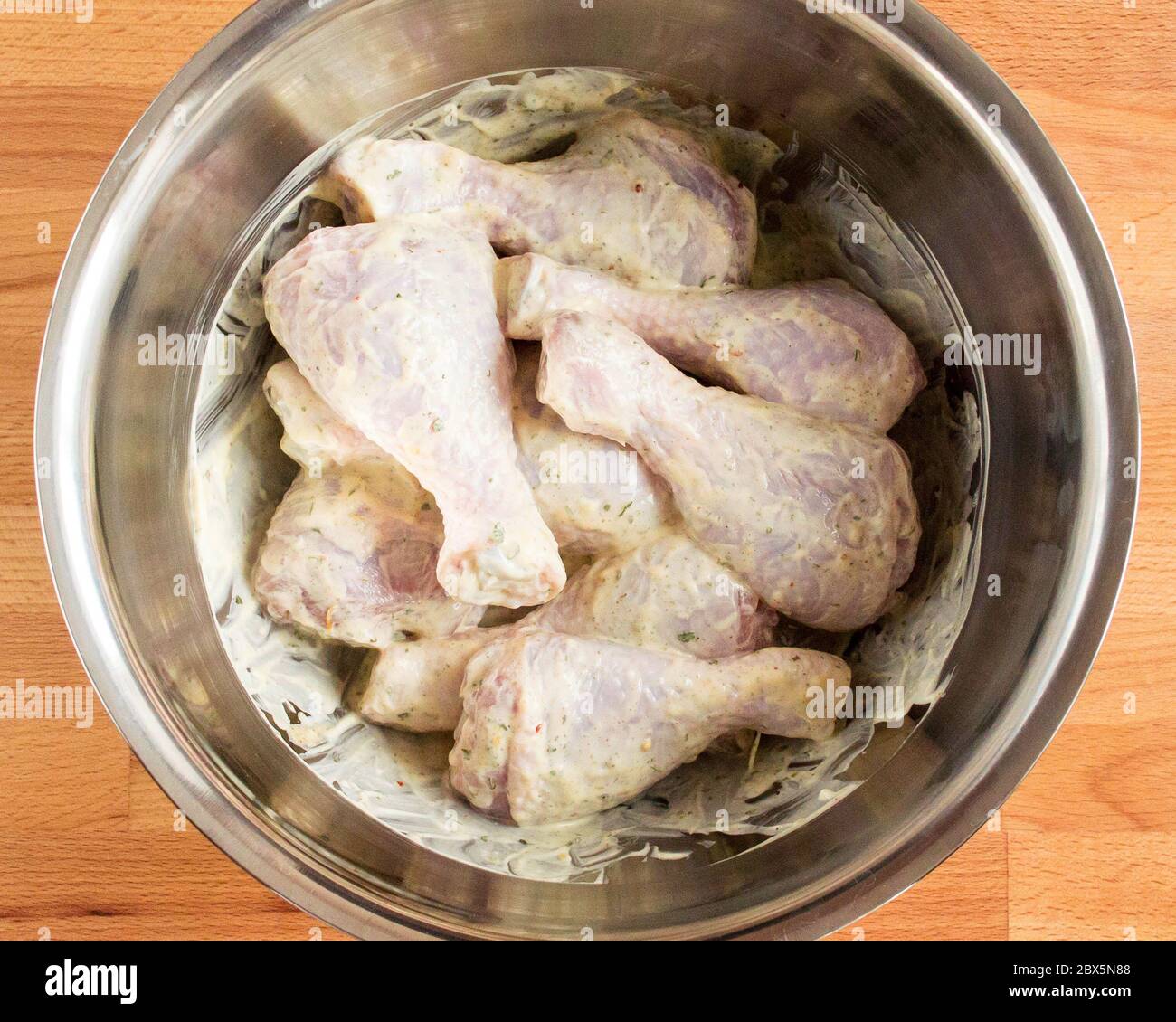 Chicken drumstick in sauce. Chicken coated with spices and mayonnaise