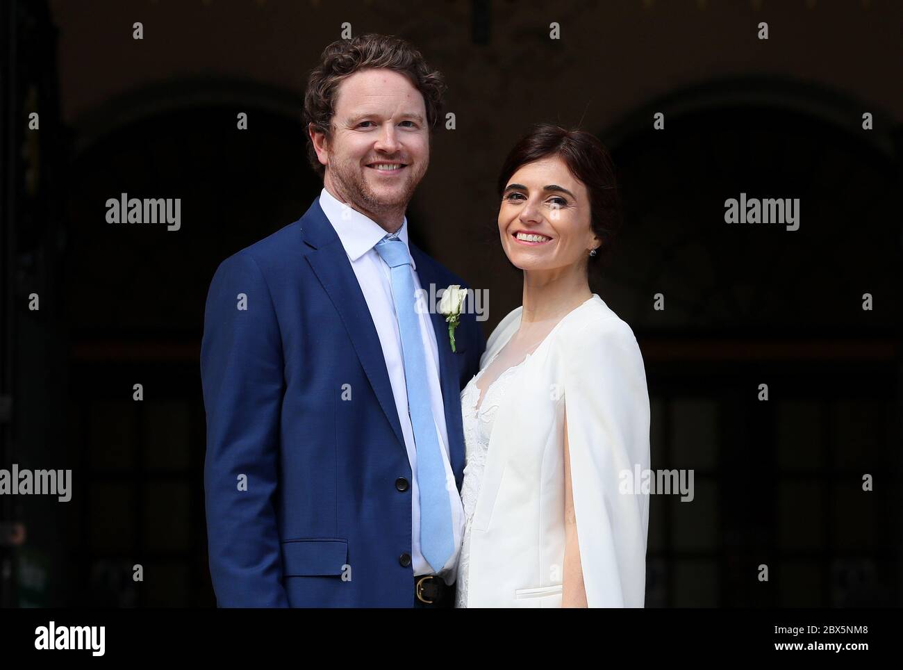 Michael McCaw, from Belfast, and Lucrecia Landeta Garcia, originally from Argentina, following their wedding ceremony at City Hall in Belfast, as outside weddings with up to six people are currently permitted, to change from Monday to ceremonies permitted outdoors, with no more than 10 people present. Stock Photo