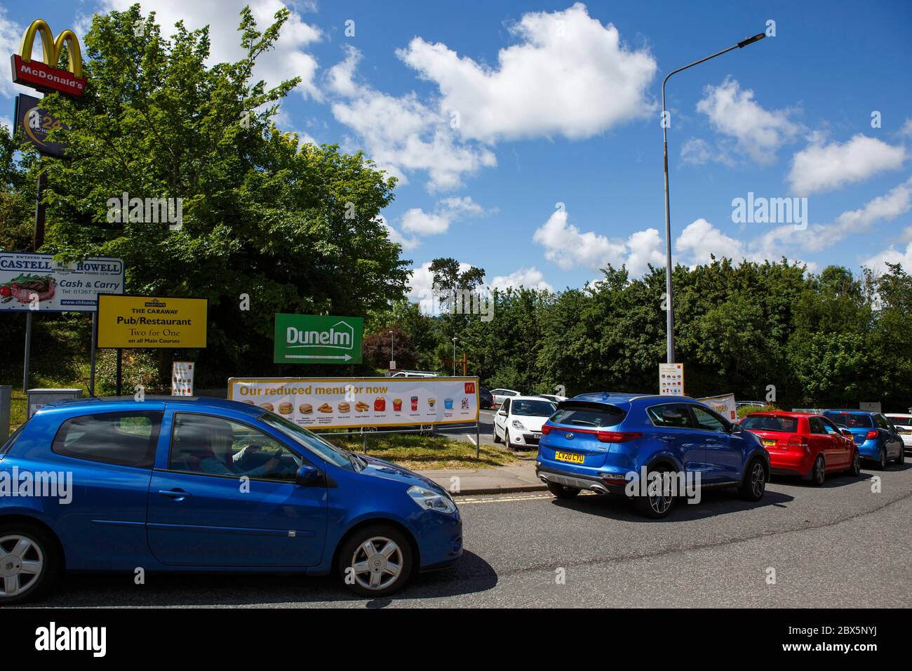 Carmarthen, UK. 5 June, 2020. Cars queuing at McDonald's in Carmarthen for its drive-through service. Credit: Gruffydd Ll. Thomas/Alamy Live News Stock Photo