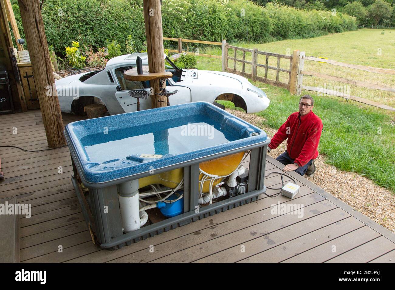 Lotus Elan +2 classic car being converted into a custom hot tub, Medstead, Alton, Hampshire England, United Kingdom. Stock Photo