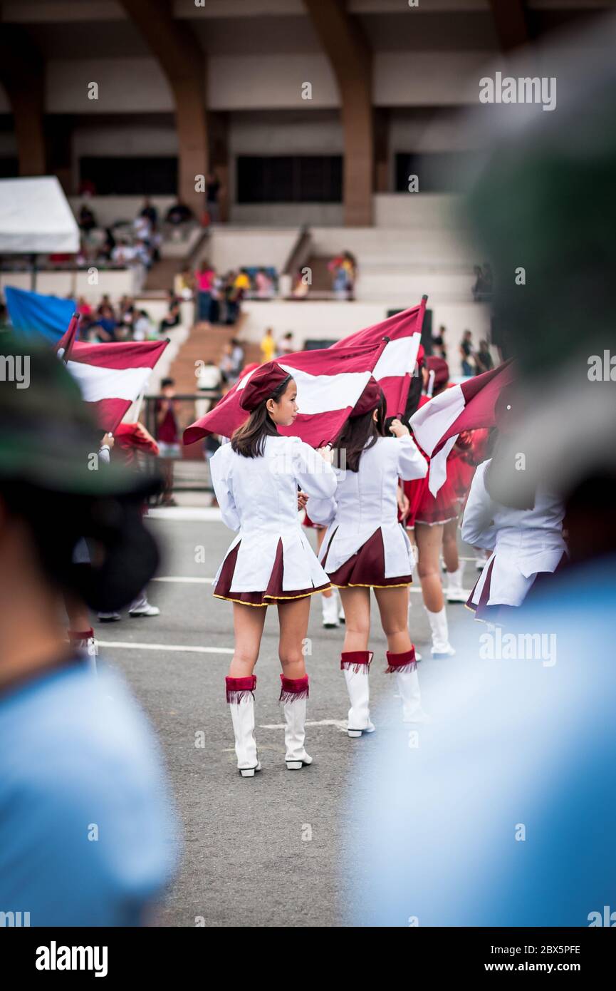 A festival parade of young Filipino girls perform at the Feast of the Black Nazarene Festival in Manila The Philippines. Stock Photo