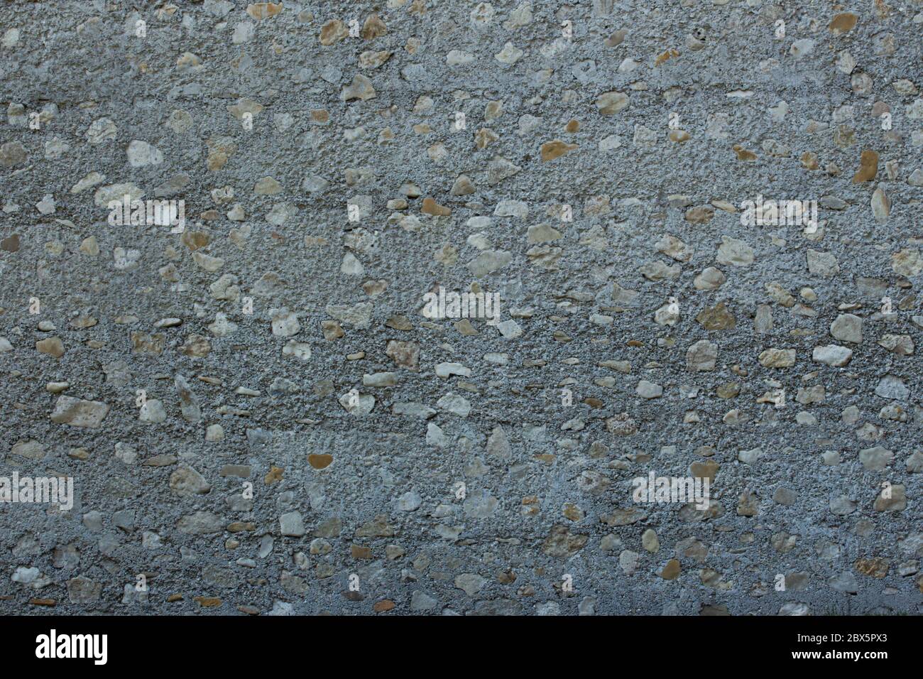 Wall background texture with big natural stones and small pebbles Stock ...