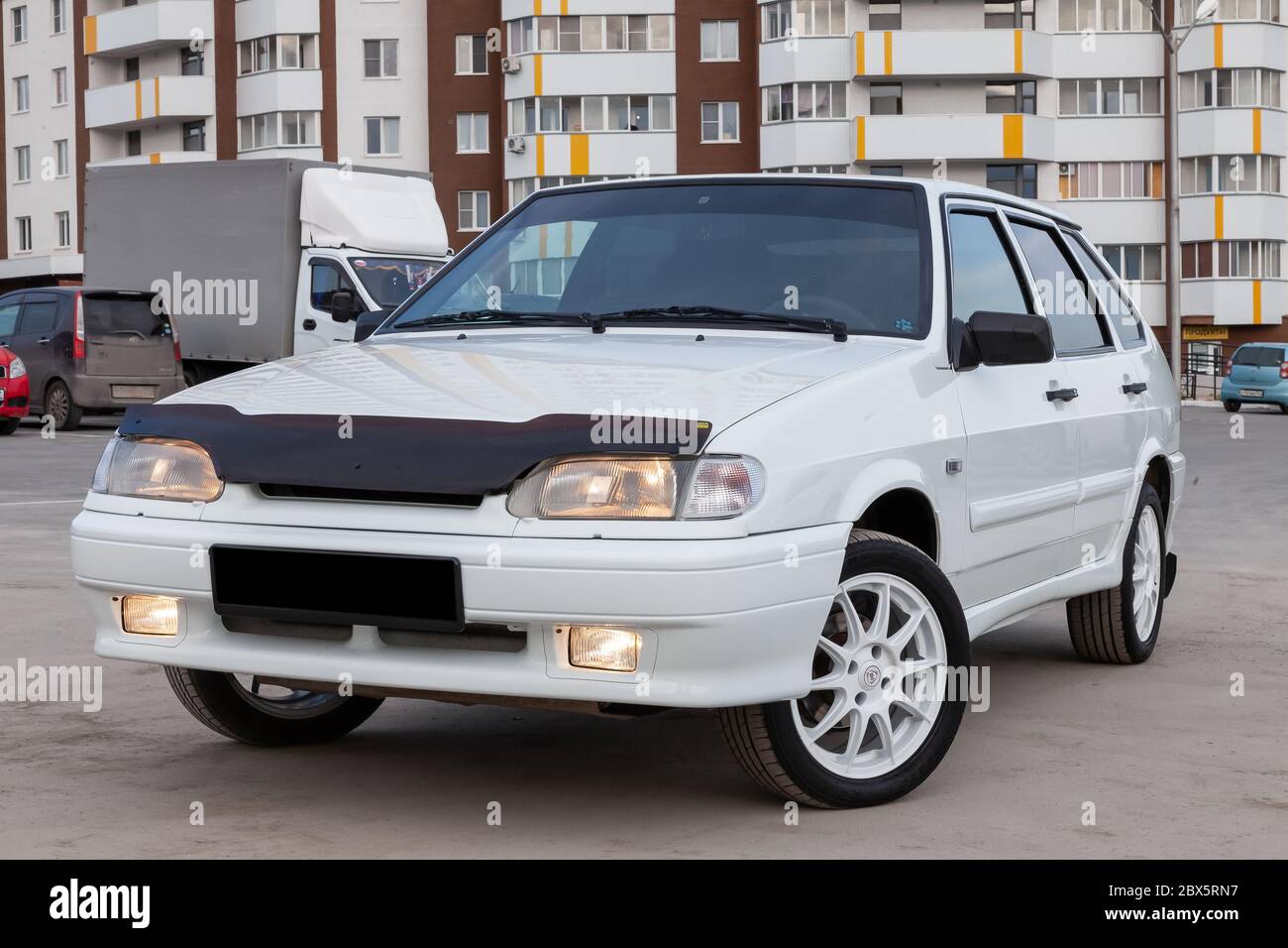 Novosibirsk, Russia - 05/20/2020: A new Russian car of the Lada brand of the automotive industry VAZ model 2114 of a modern white series with burning Stock Photo