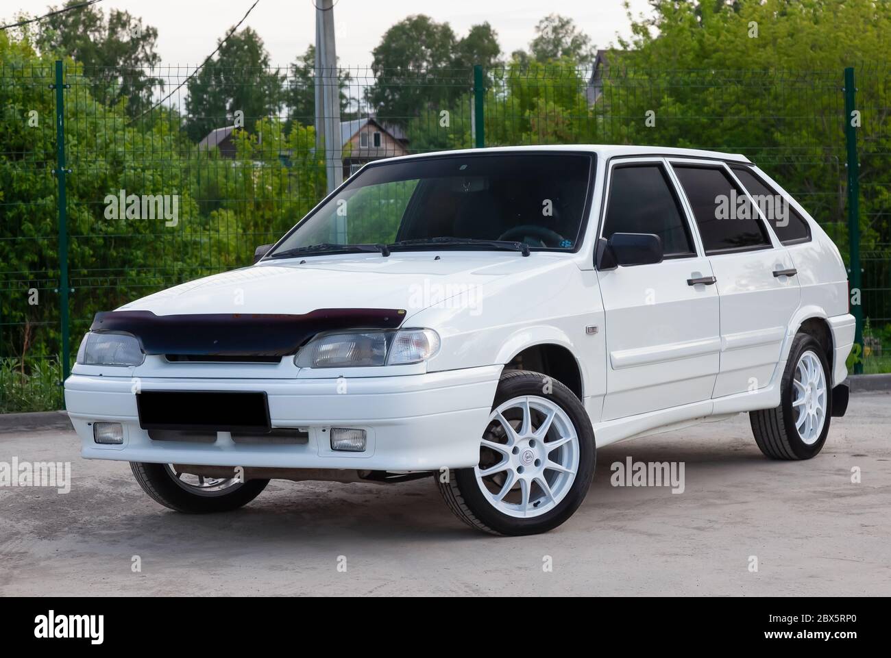 Novosibirsk, Russia - 05.20.2020: The new domestic Russian car brand Lada automobile industry VAZ model 2114 of a modern series of white color and dri Stock Photo