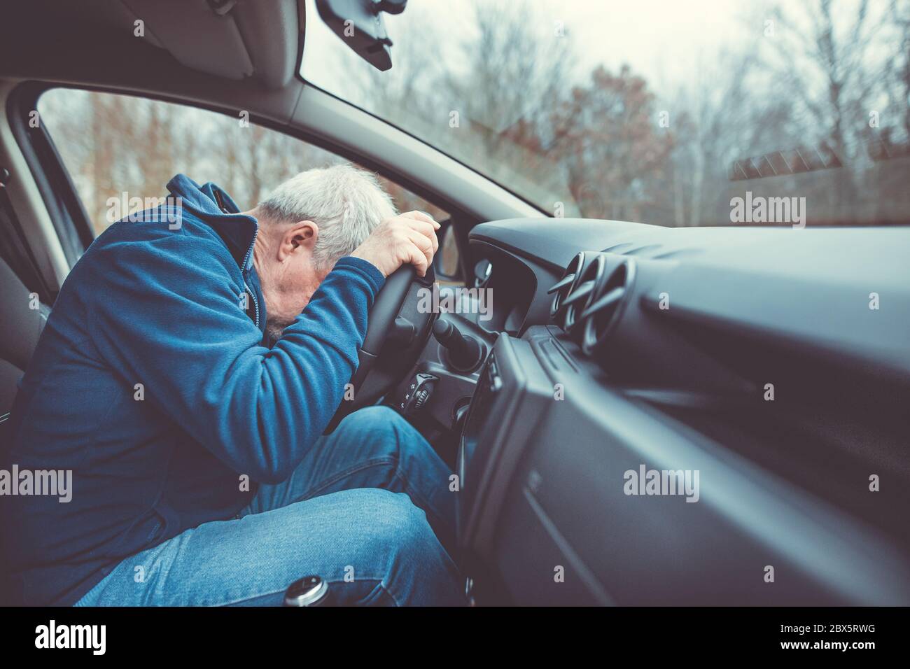 Man driving car and falling asleep at the wheel transportation concept