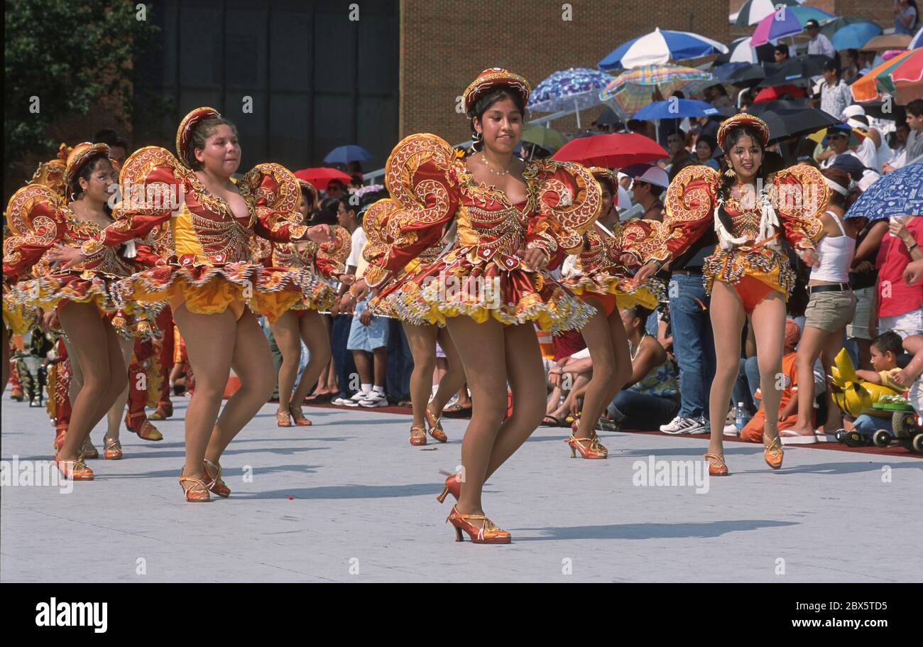 ARLINGTON, VIRGINIA, USA, AUGUST 2002 - Young Bolivian women in costume dancing during Bolivian Folklore festival parade. Stock Photo
