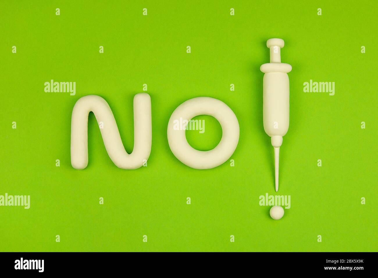 'No compulsory vaccination' concept. The debate about freedom of choice and vaccination damage. 3d mock-up with syringe, the word 'no', and exclamatio Stock Photo