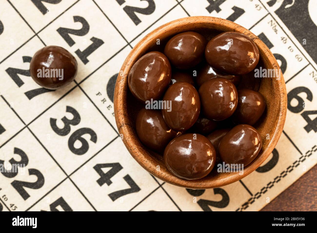 Chocolate Covered Peanuts in a Bowl Stock Photo