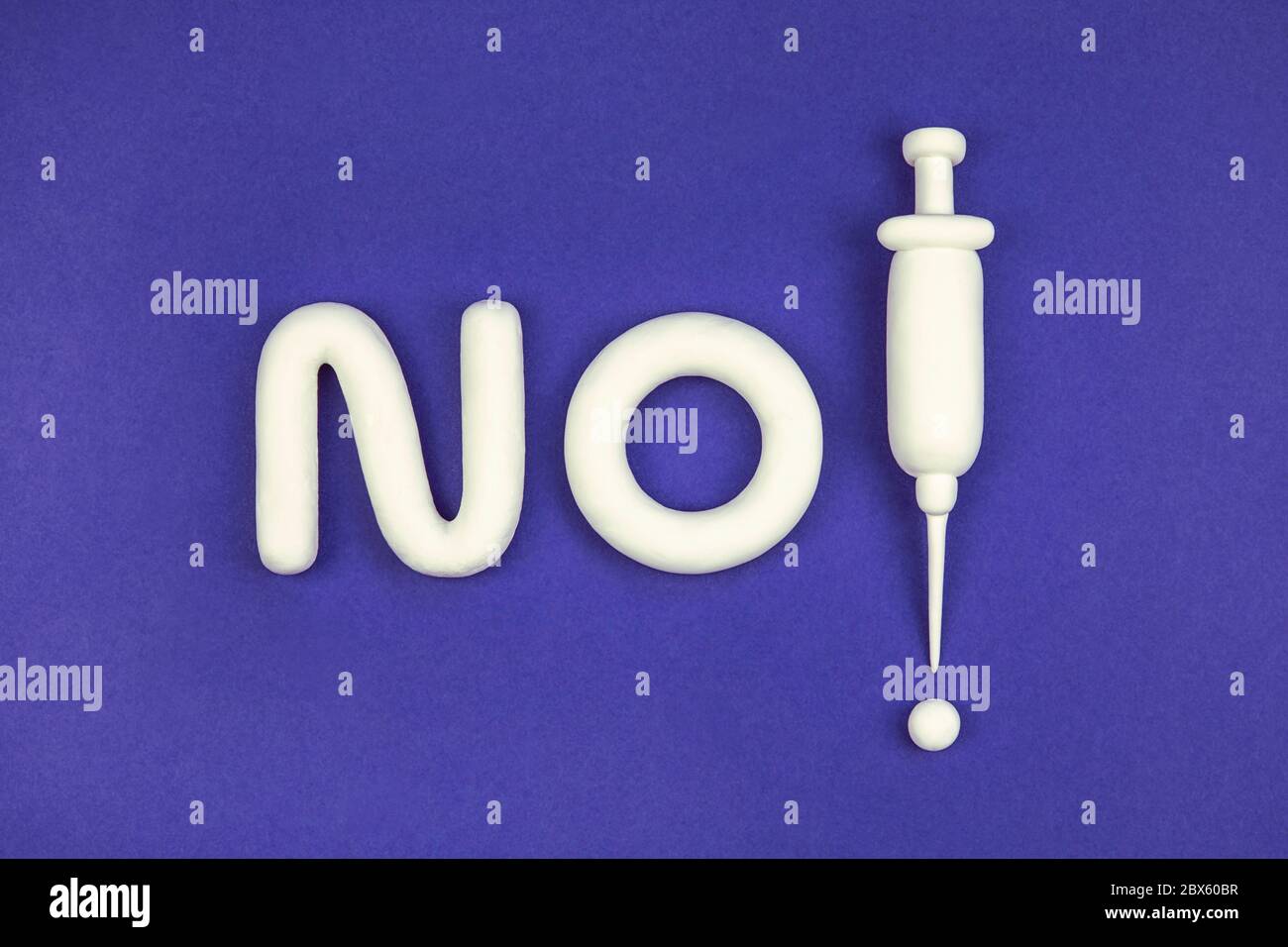 'No compulsory vaccination' concept. The debate about freedom of choice and vaccination damage. 3d mock-up with syringe, the word 'no', exclamation Stock Photo