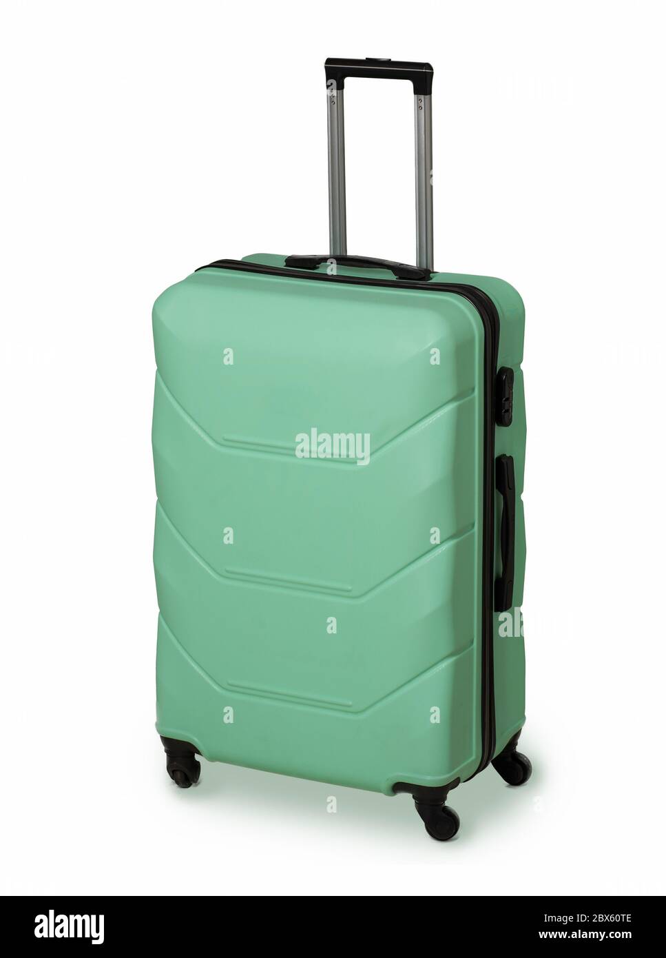 Mint Green suitcase for travel and reliable luggage storage. Plastic suitcase with wheels and retractable handle. Vacation concept. Luggage protection Stock Photo