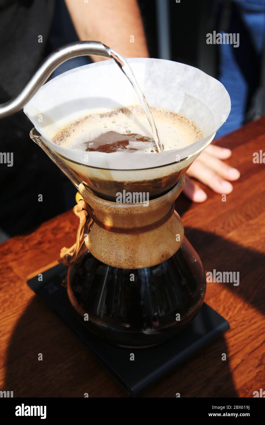 barista preparing coffee at coffee shop restaurant. drip brewing