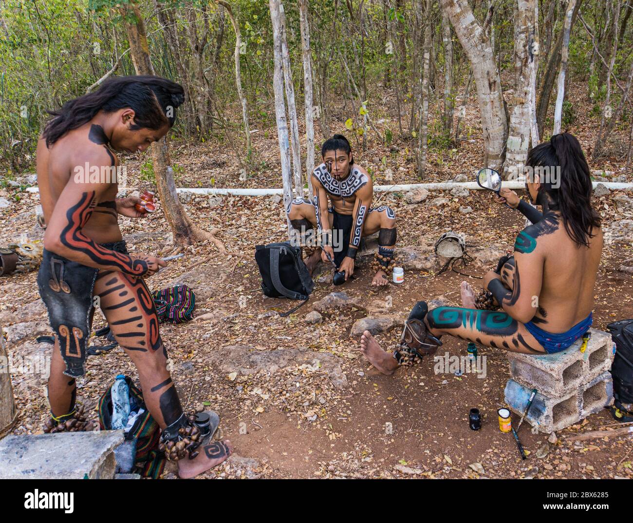 Valladolid, Yucatan/Mexico - February 24,2020: young Mayan men preparing themselves in costume for performing traditional Mayan ceremony Stock Photo