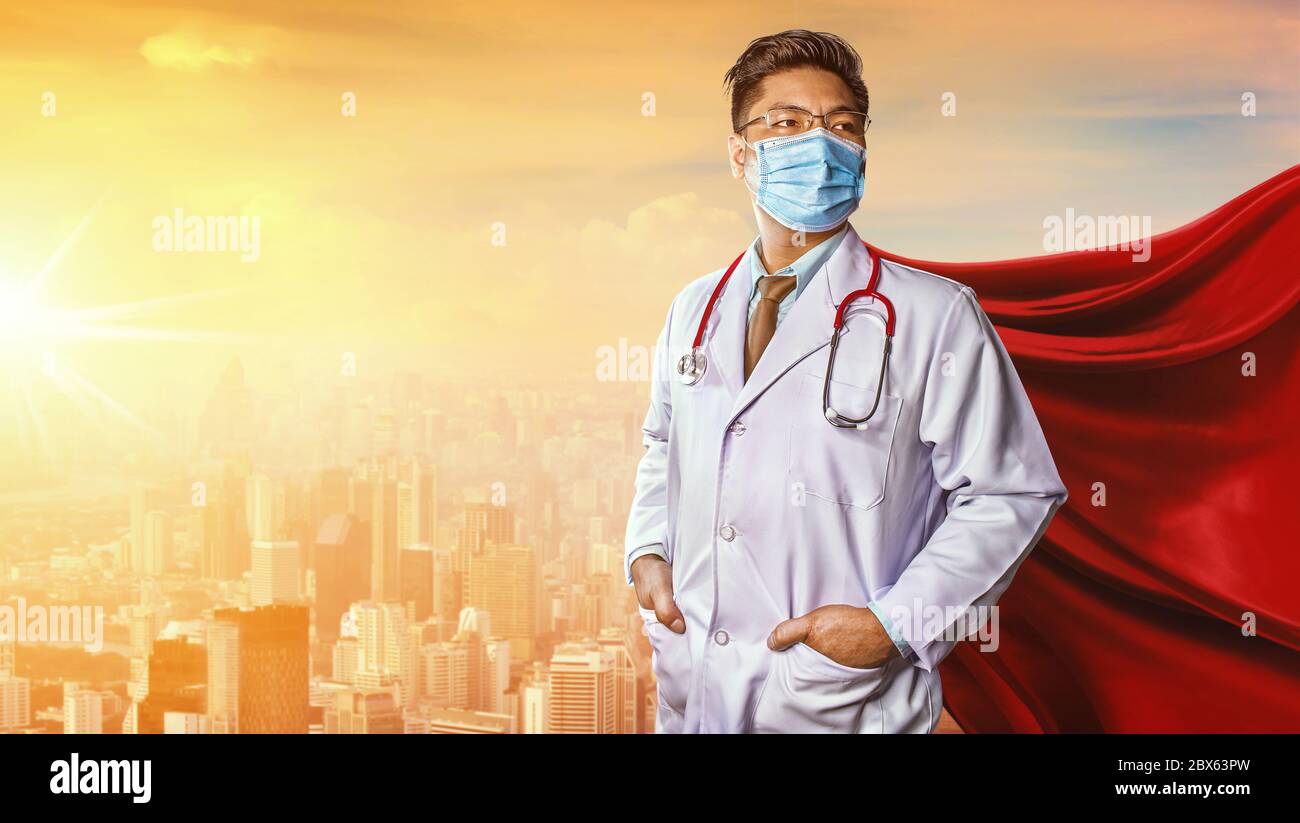 Doctor wearing medical mask . Super hero power for medicine. Corona Virus Covid 19 Stock Photo