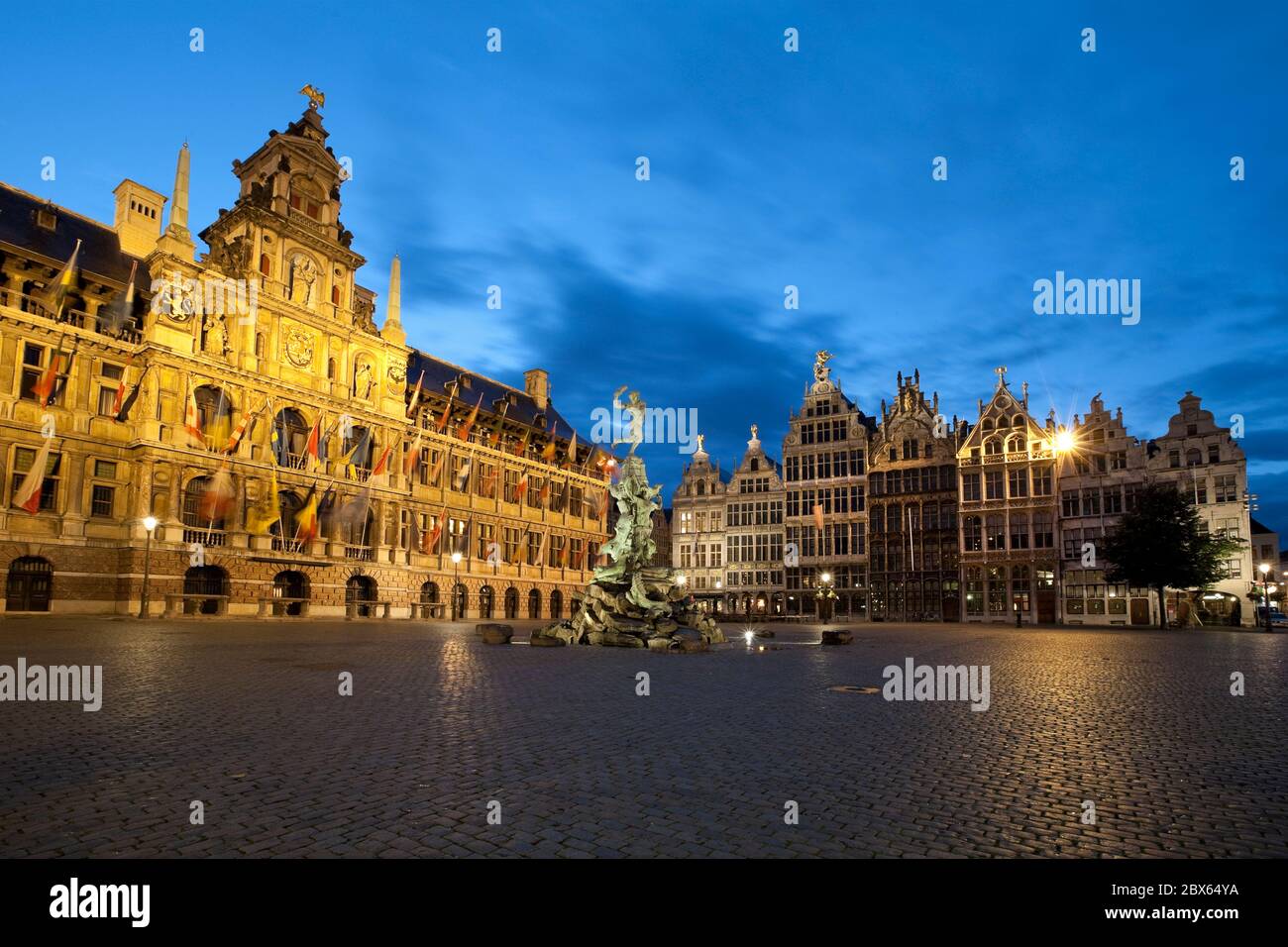 Night shot of the Grote Markt with the Town Hall and Guild Halls. Stock Photo
