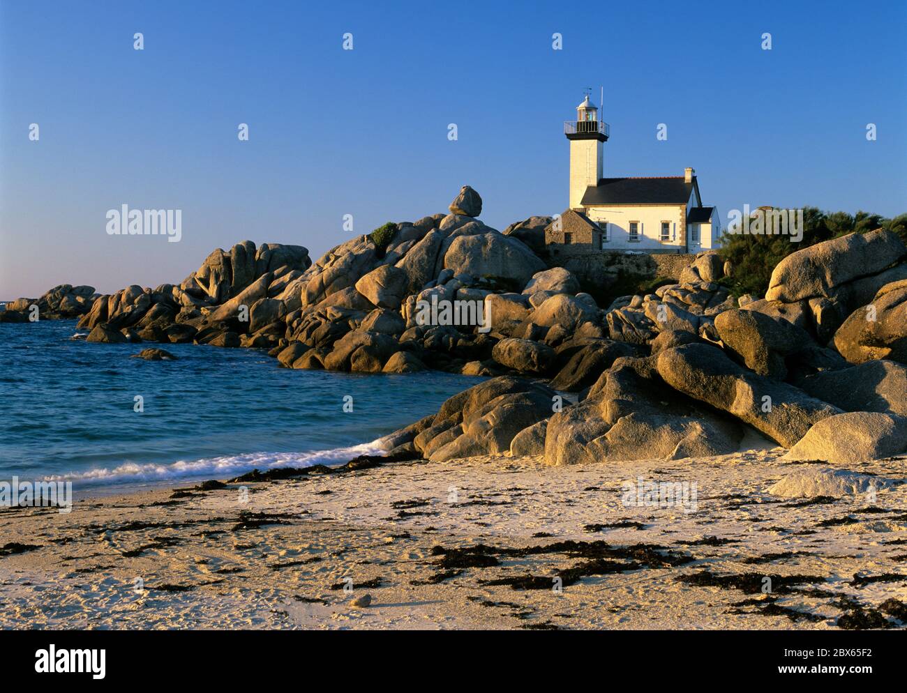 Pointe de Pontusval Lighthouse at sunset, Brignogan Plage, Finistere, Brittany, France Stock Photo
