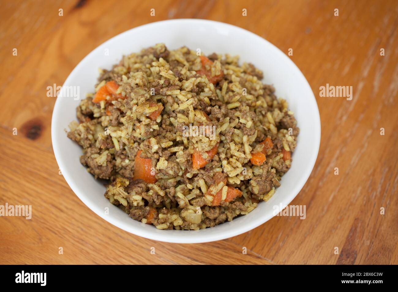 Iraqi carrot rice a typical dish served with minced beef Stock Photo