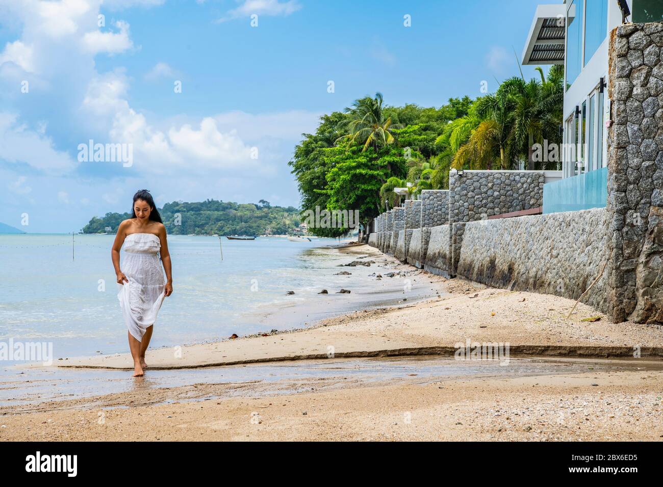 beautiful woman in white dress walking on the beach in Phuket Stock ...