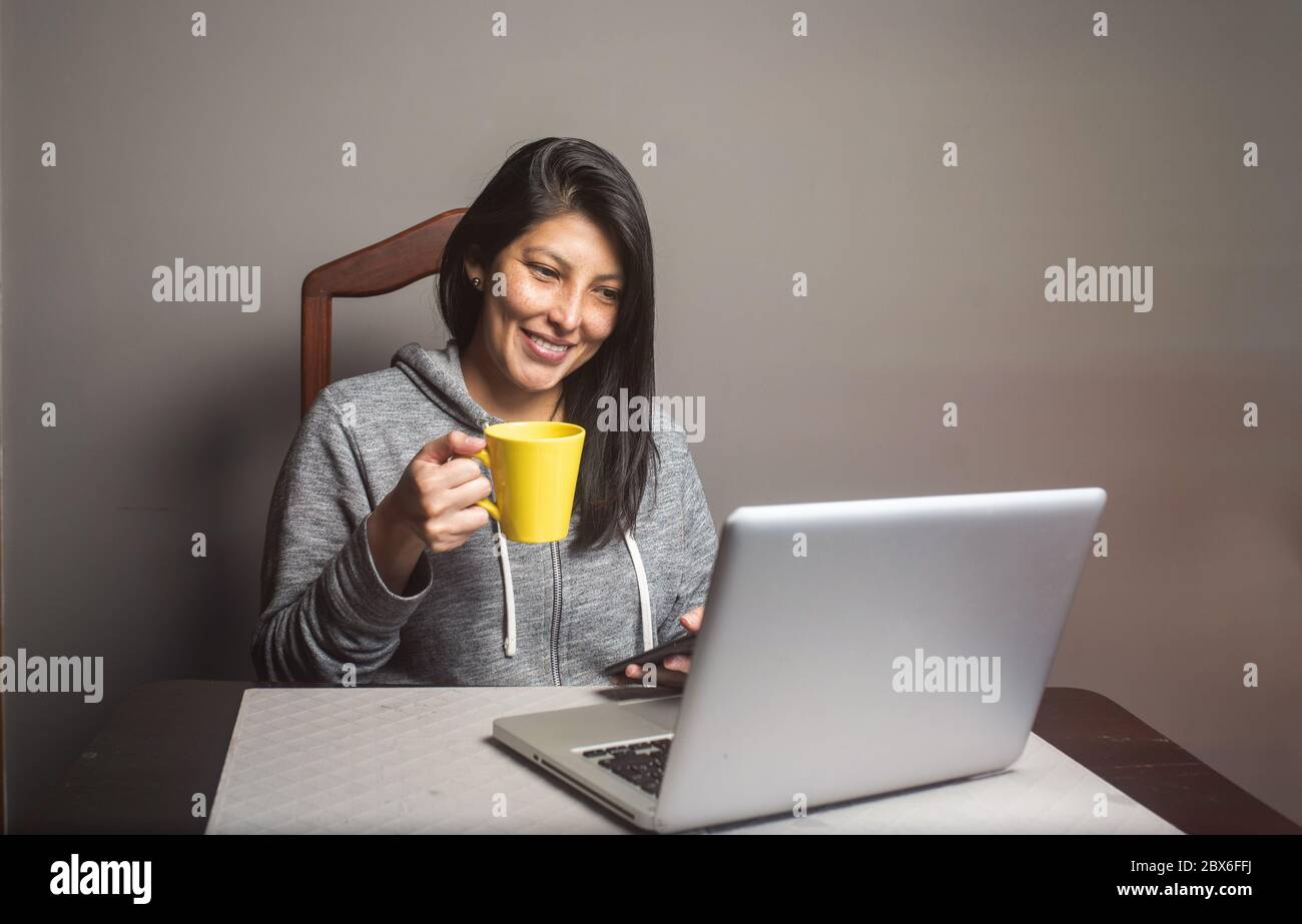 pretty woman having a video conference at home Stock Photo