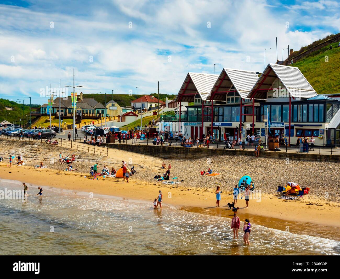 Saltburn Beach shops on the day following the reduction in lockdown provision during the corona virus pandemic in 2020 family groups can meet with frie Stock Photo