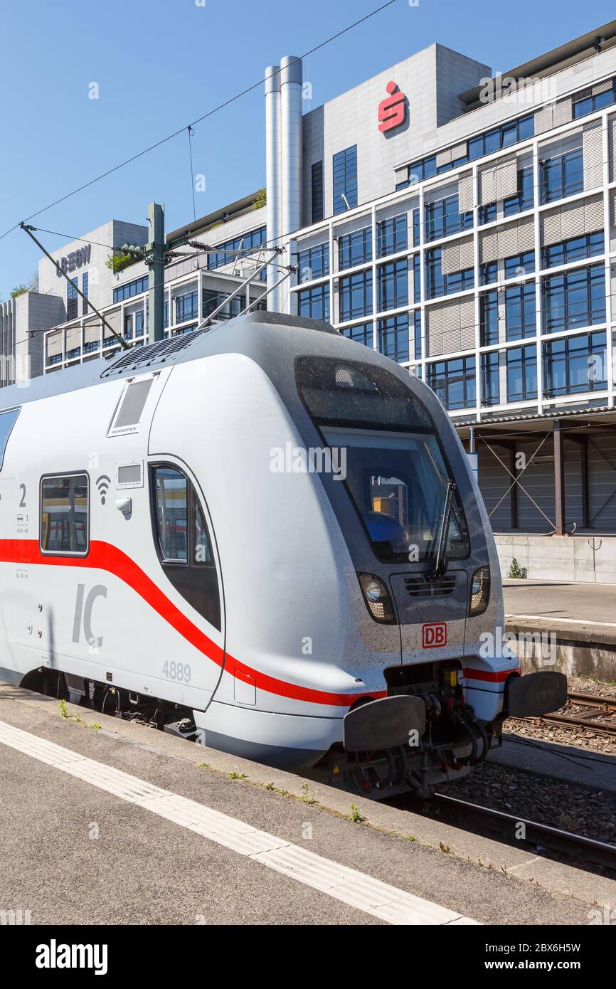 Stuttgart, Germany - April 22, 2020: IC2 Intercity 2 double-deck train locomotive at Stuttgart main station railway in Germany portrait format. Stock Photo