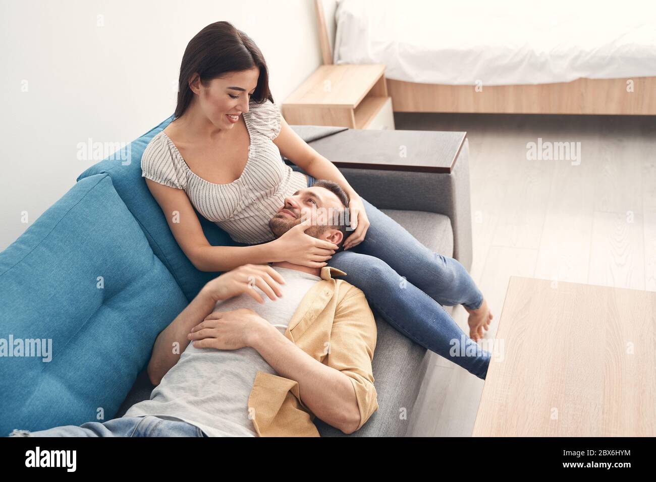 Lovely newlyweds resting and relaxing at home together Stock Photo