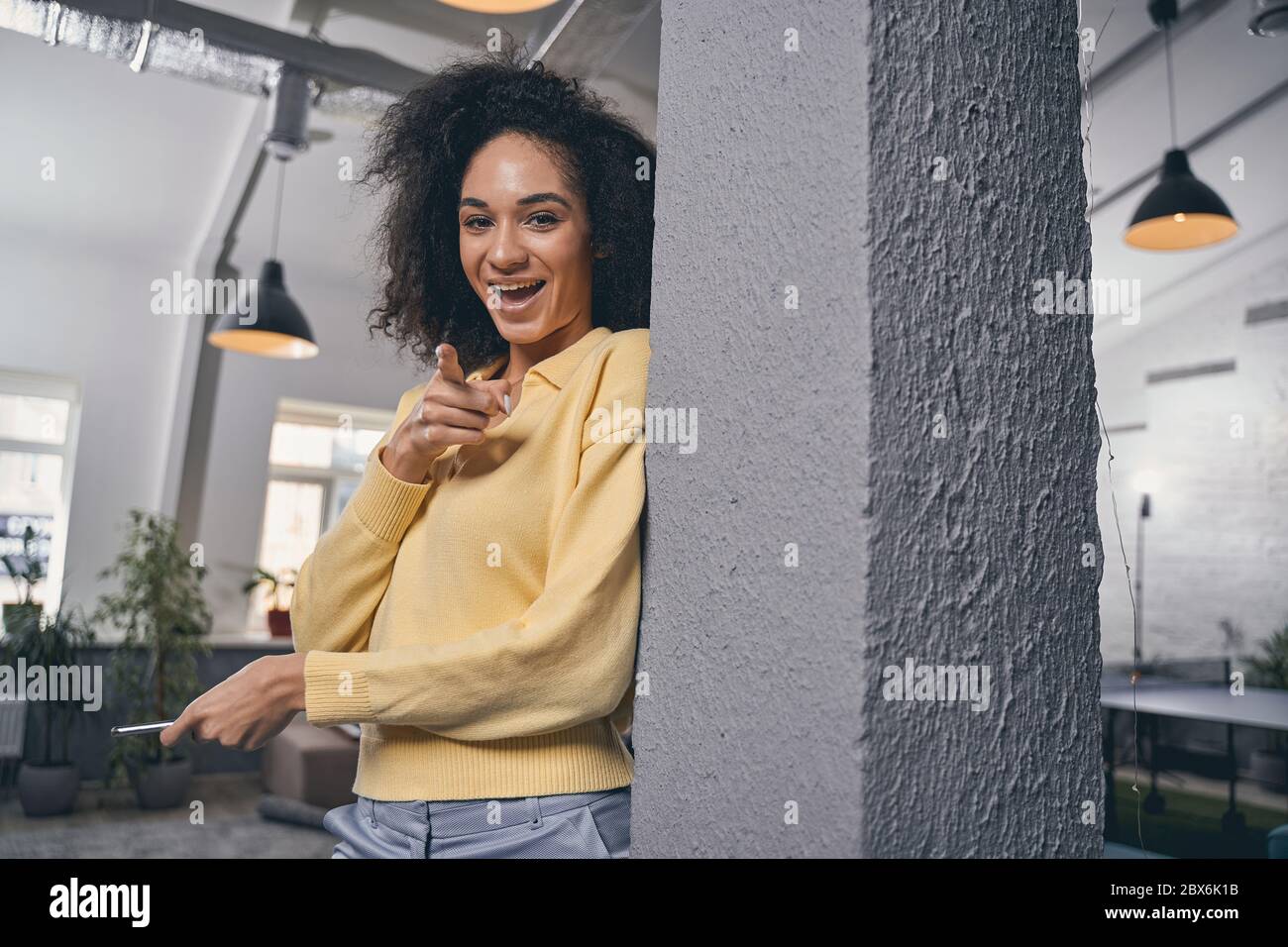 High-spirited lady pointing her finger at the camera Stock Photo