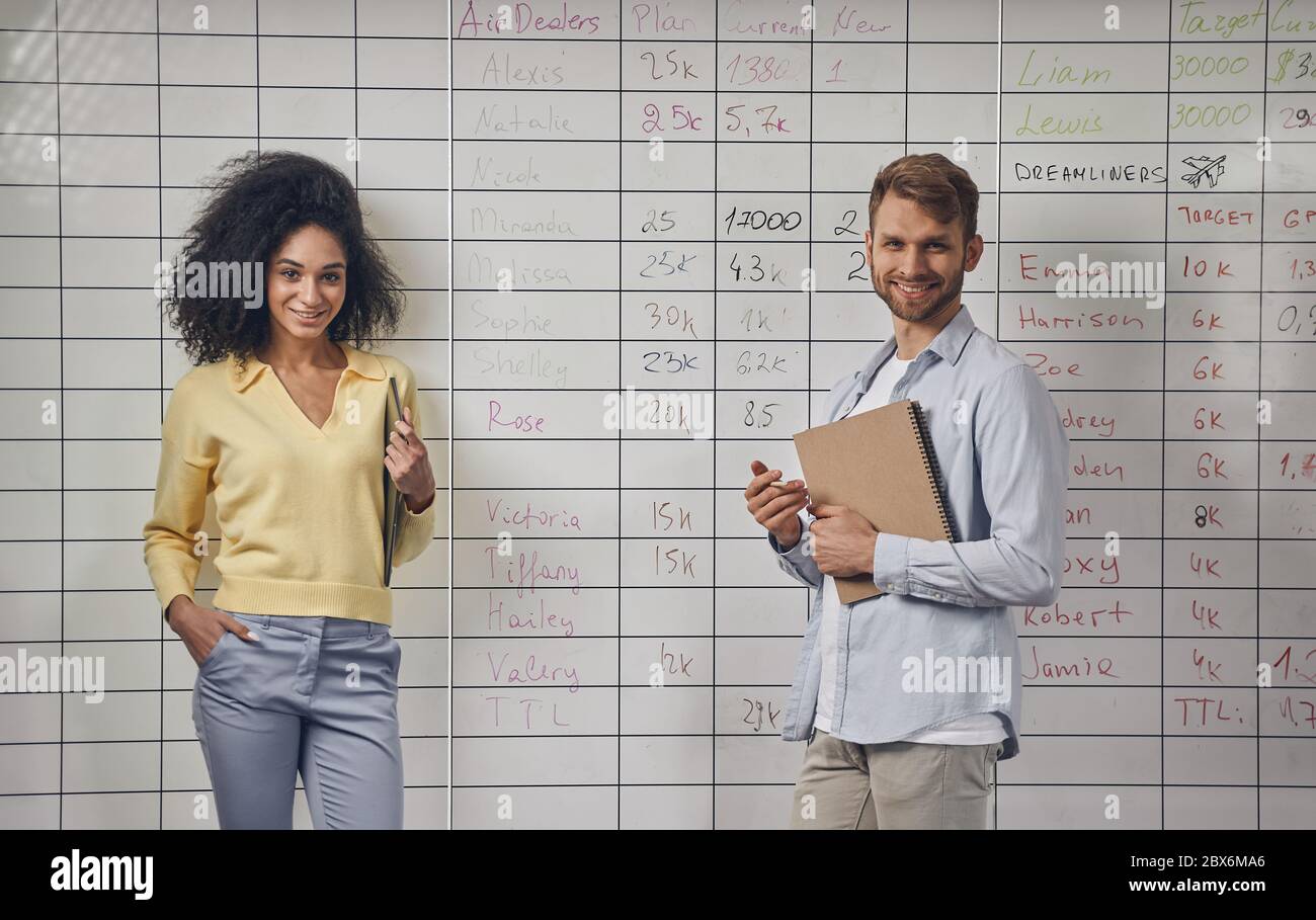 Joyful office workers posing for the camera Stock Photo