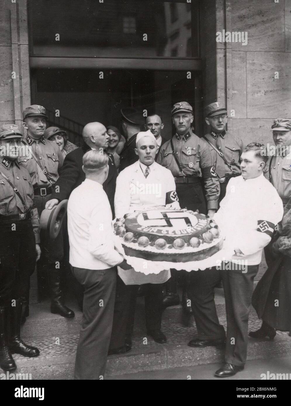 The Birthday Cake Heinrich Hoffmann Photographs 1933 Adolf Hitler's official photographer, and a Nazi politician and publisher, who was a member of Hitler's intimate circle. Stock Photo