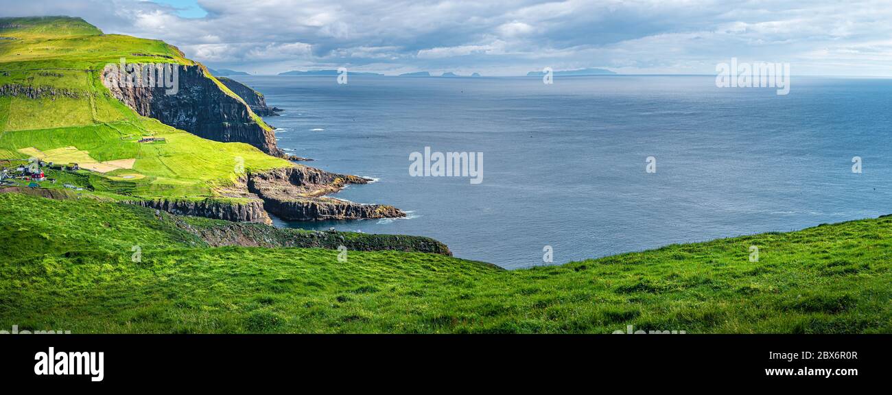 Panoramic view over mythical Faroe Island Mykines in the middle of Atlantic Ocean with a lot of puffins, parrot like seabirds Stock Photo