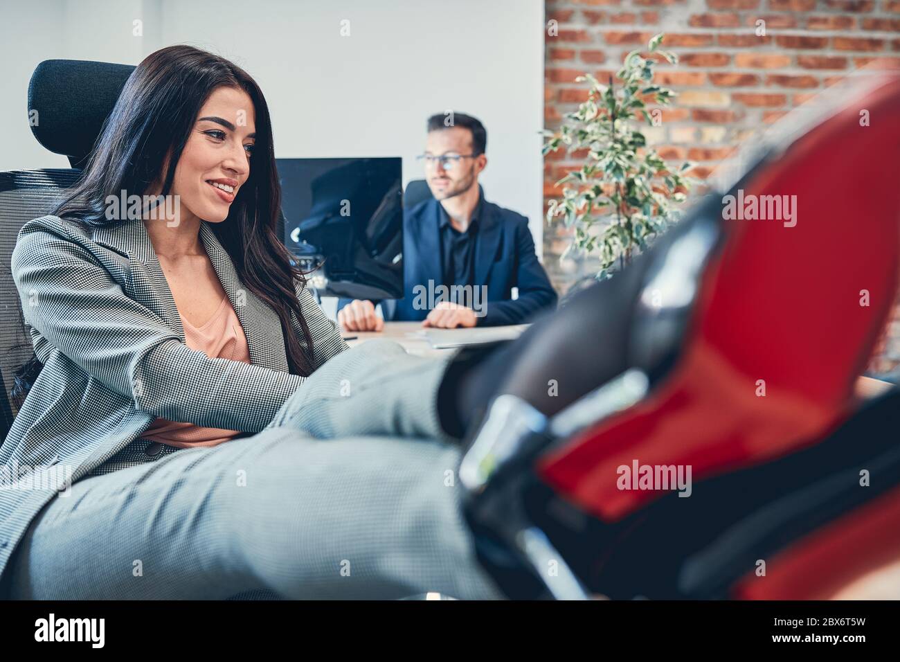 Young creative managers working at their pc Stock Photo