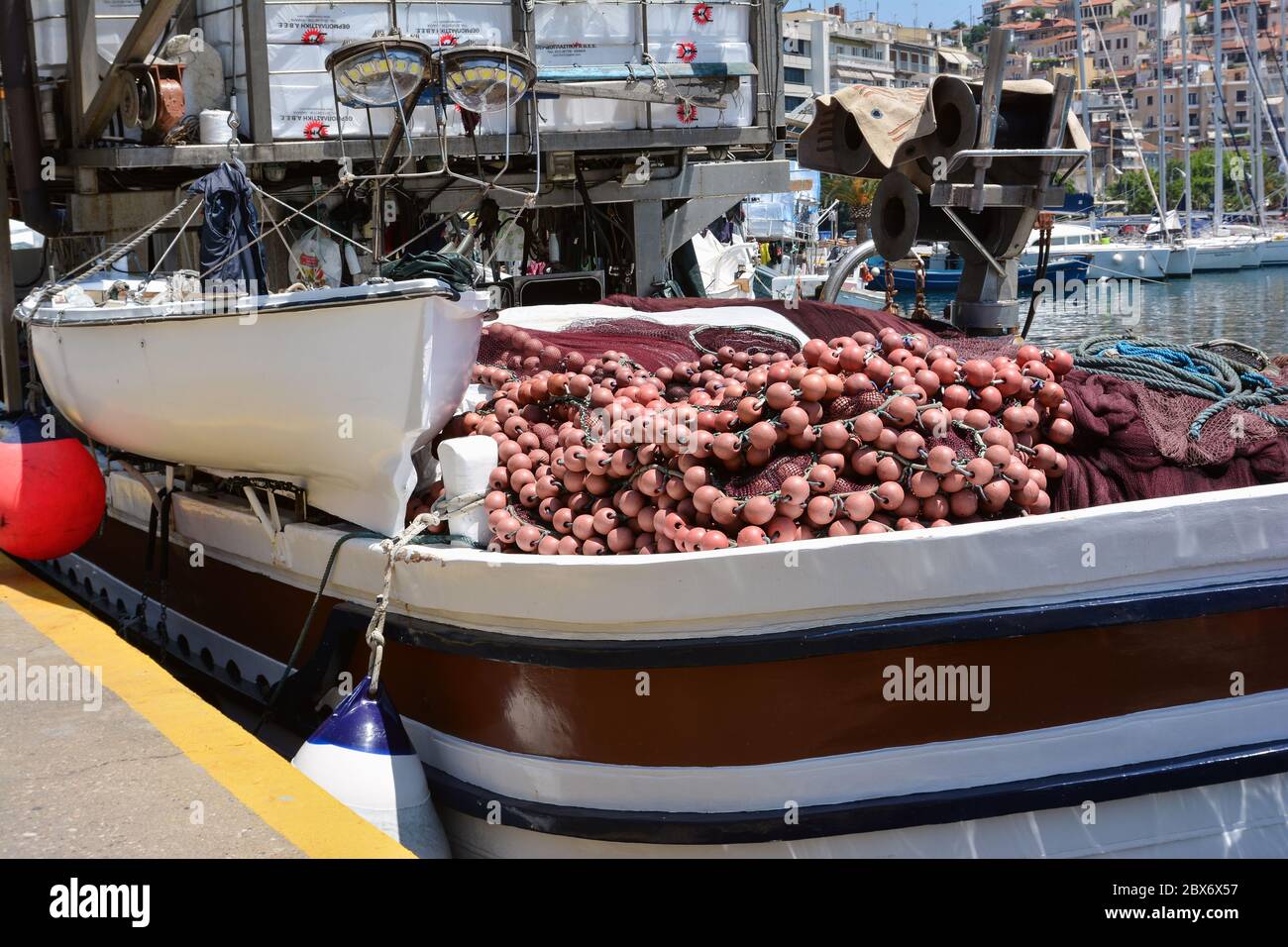 KAVALA, GREECE- MAY 31, 2016: Fishing nets and buoys on board a fishing boat in the port of Kavala, Greece. Stock Photo