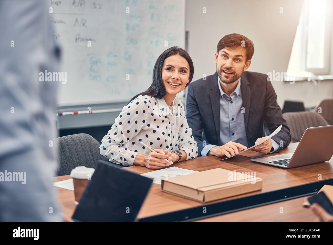 Managers discussing possibility of cooperation with partners Stock Photo