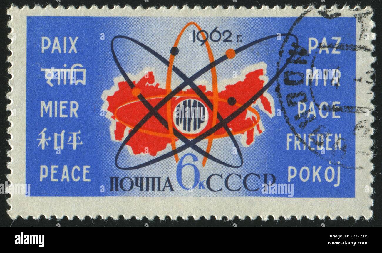 RUSSIA - CIRCA 1962: stamp printed by Russia, shows map and Atom Symbol, circa 1962. Stock Photo