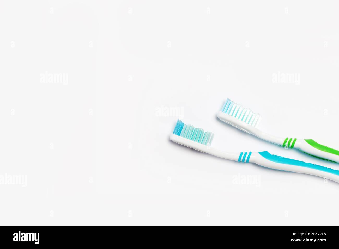 New different colored toothbrushes on a white background Stock Photo
