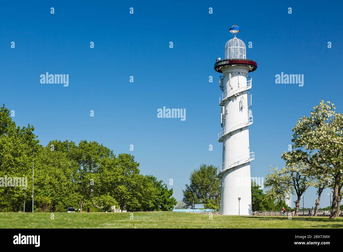 The lighthouse on the Donauinsel (Danube island) with blue sky in spring. Vienna, Austria. Stock Photo