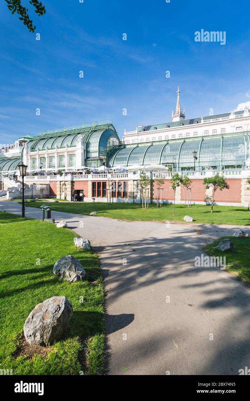 The Palmenhaus next to the Vienna Burggarten in Austria with blue sky. Stock Photo