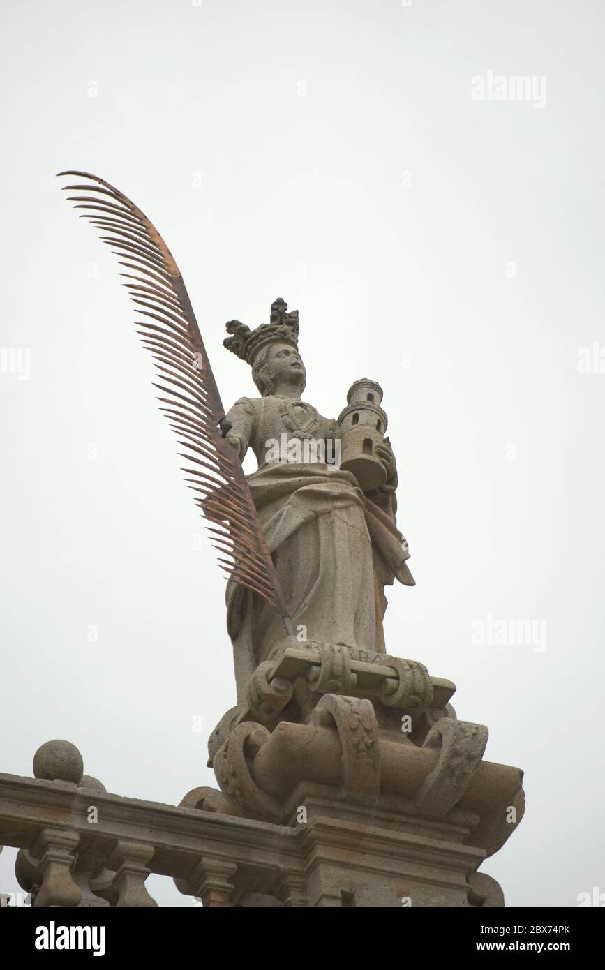 Saint Barbara. Statue on the balustrade of the main facade. Santiago de Compostela Cathedral. Santiago de Compostela, La Coruña province. Galicia, Spain. Stock Photo