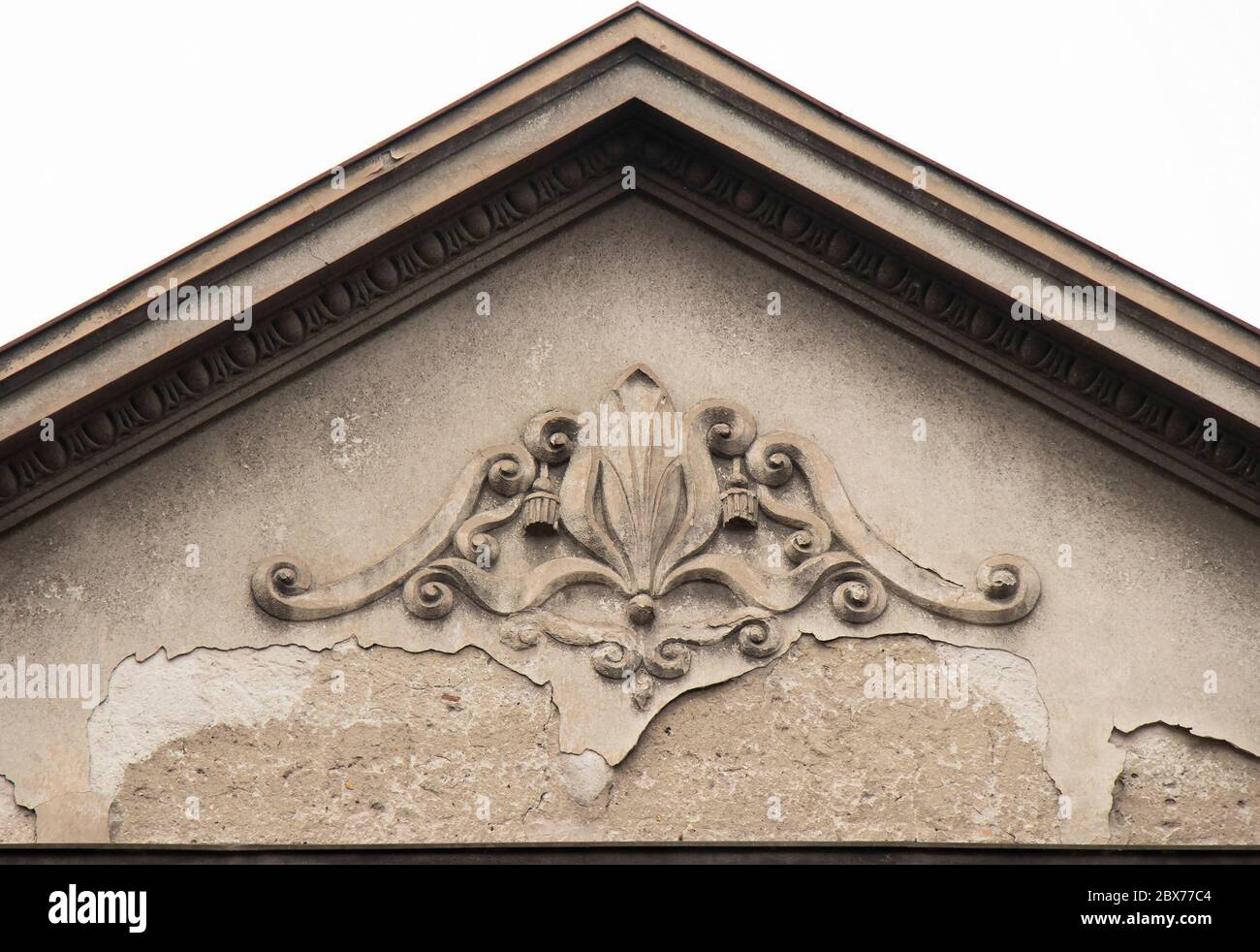 An architectural ornament relief on the top of front house facade, vintage  roof peak decoration Stock Photo - Alamy
