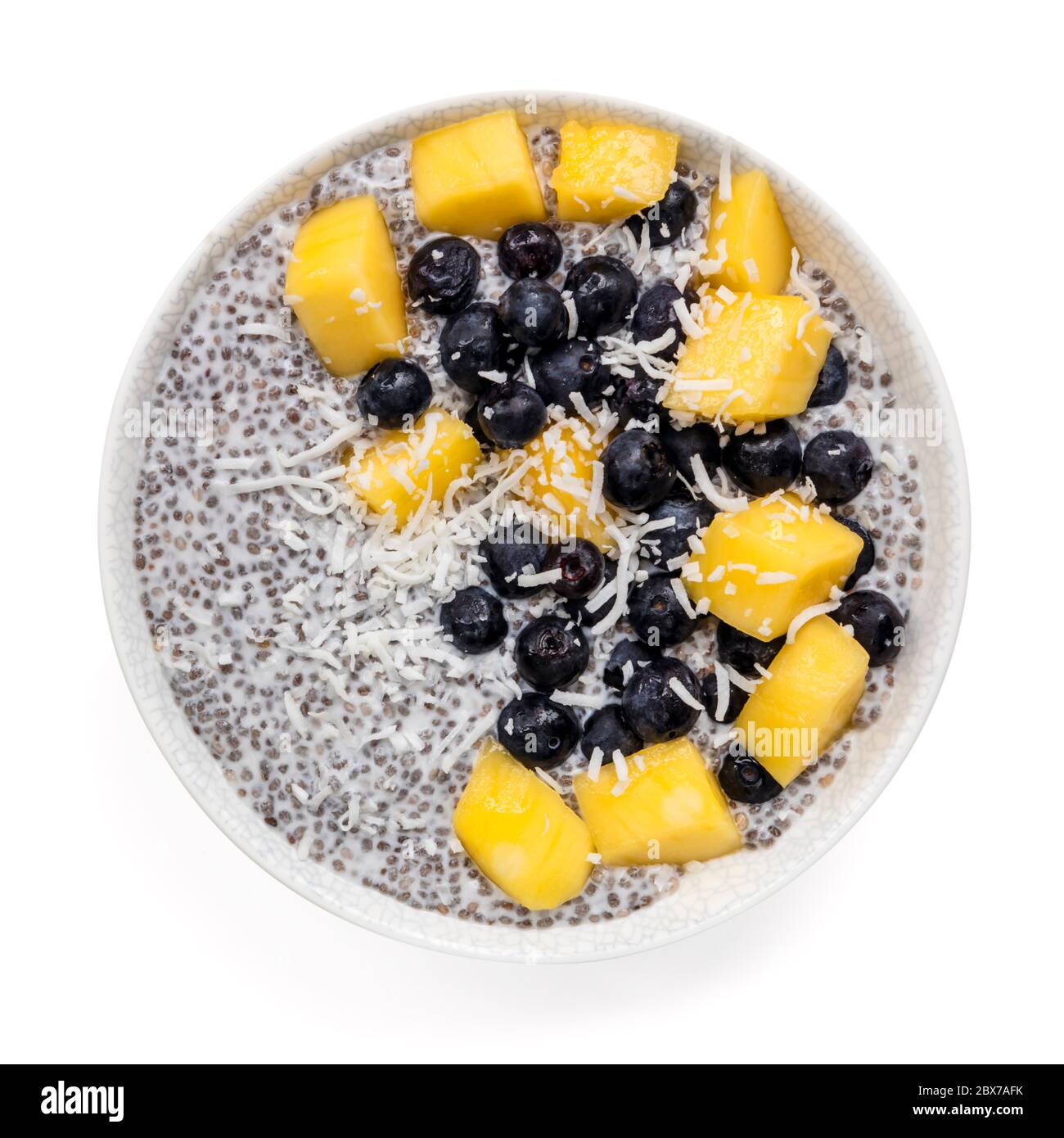 Chia seed pudding with mango, blueberries and coconut. Top view