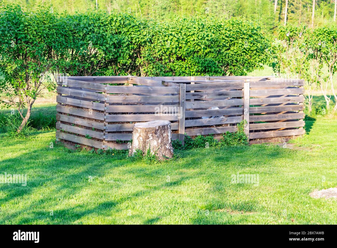 Very large three section wooden compost box standing in the Swedish
