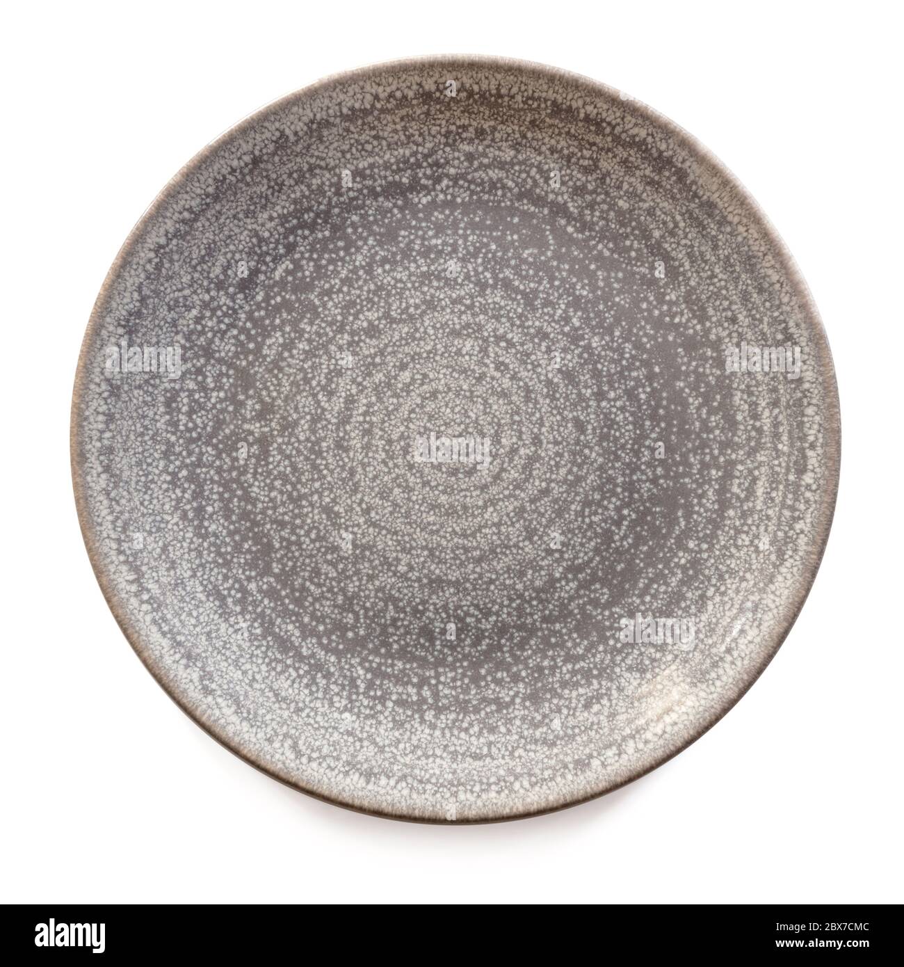 Round gray stoneware plate, empty.  Top view, isolated on white. Stock Photo