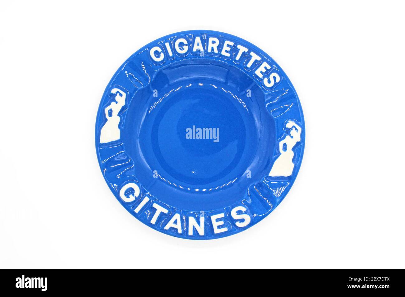 Ceramic ashtray with Gitanes, isolated on a white background, close up Stock Photo